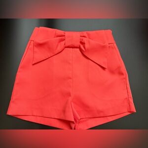 Jaspal sateen peachy orange pink high rise shorts with flat front bow